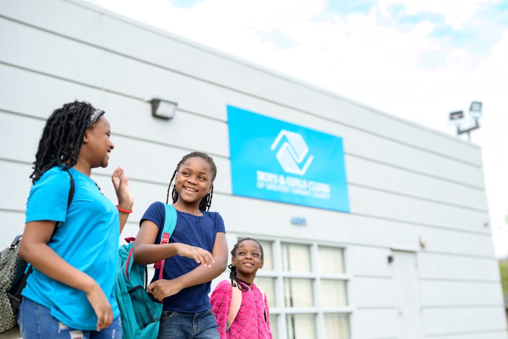 The young girls walk in front of Boys and Girls Club in Fort Worth Texas
