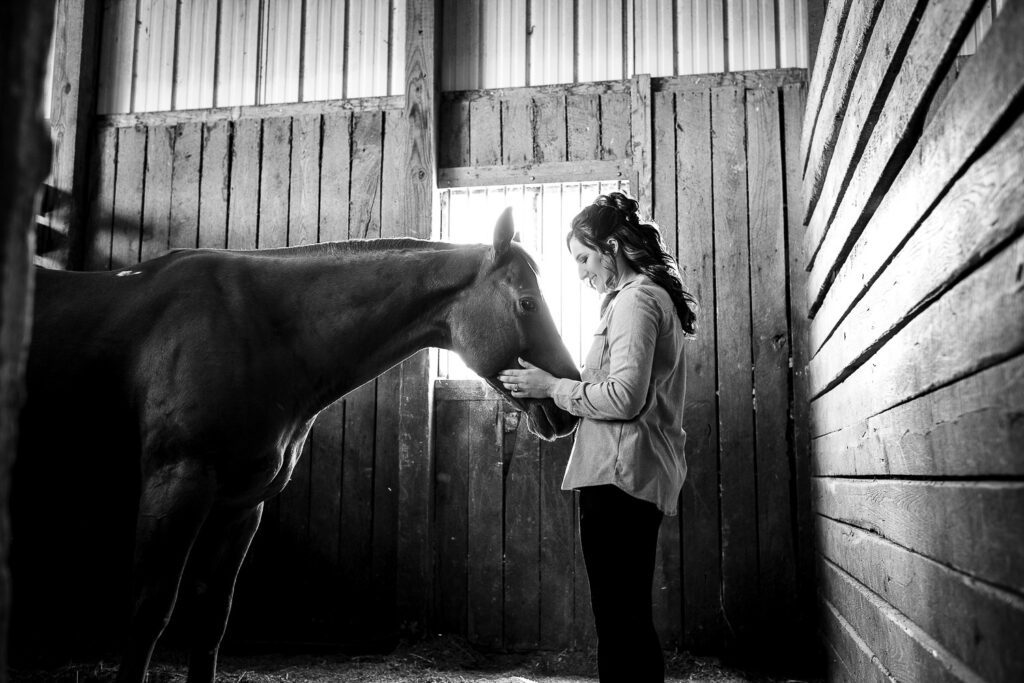 bride talks with her horse before wedding ceremony