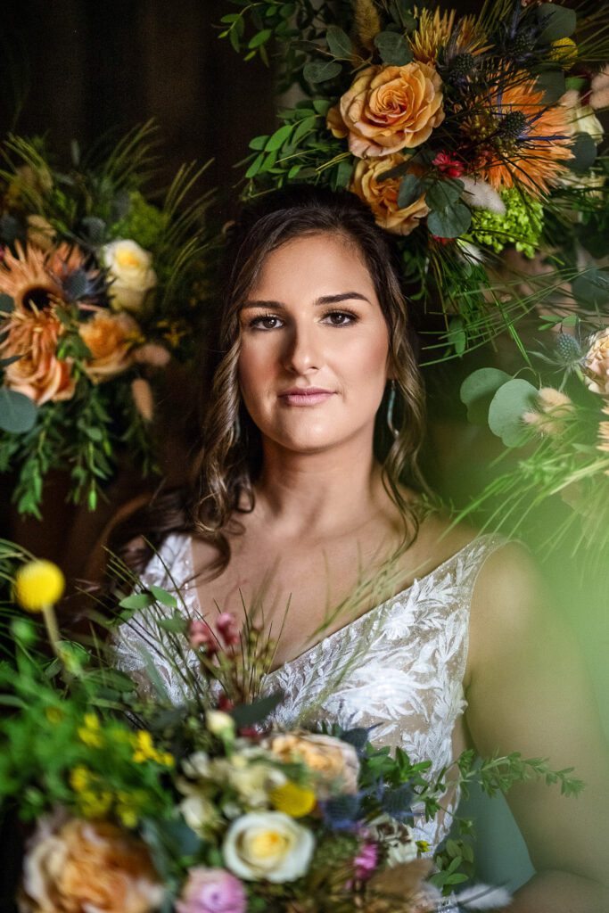 bride surrounded by her wedding bouquets 