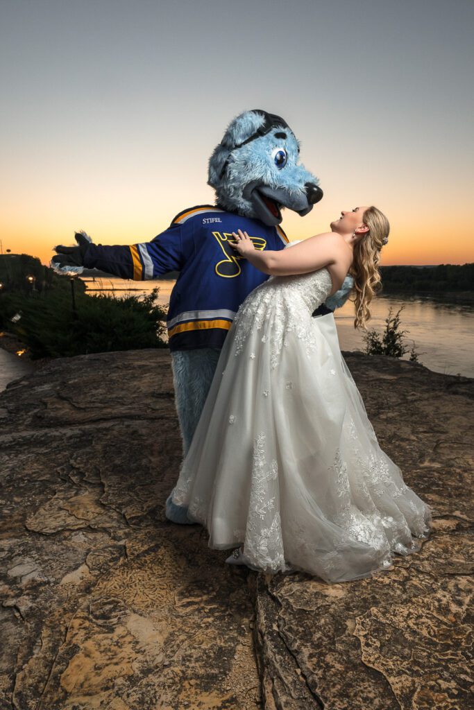 Bride dances with st louis blues mascot at hermann hill weddings