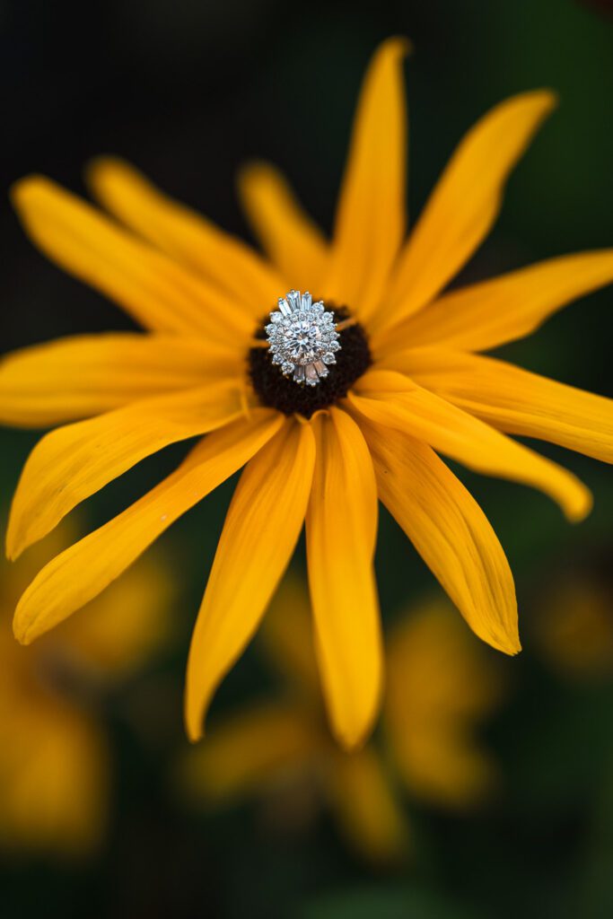 diamond wedding ring on yellow flower