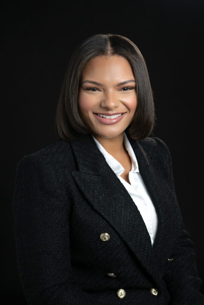 professional headshot with woman wearing black blazer