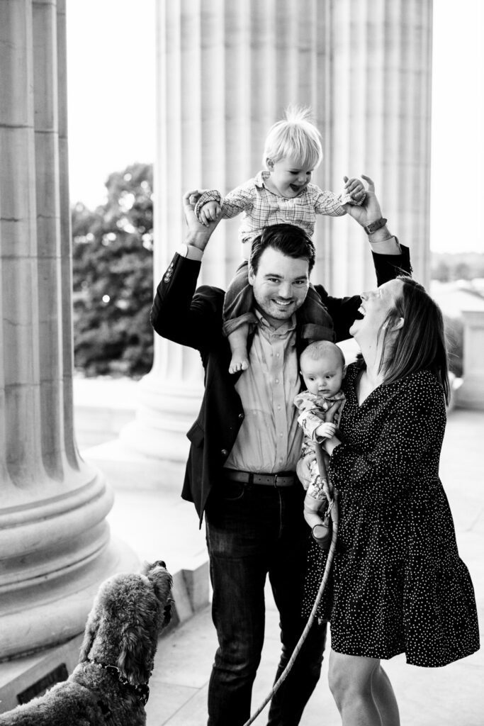 Family laughs while getting photos taken at the Missouri State Capitol