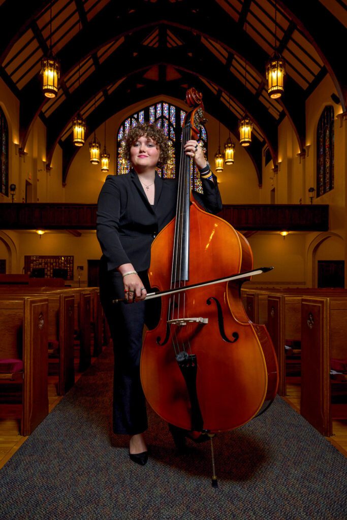 Senior Girl plays upright bass in church