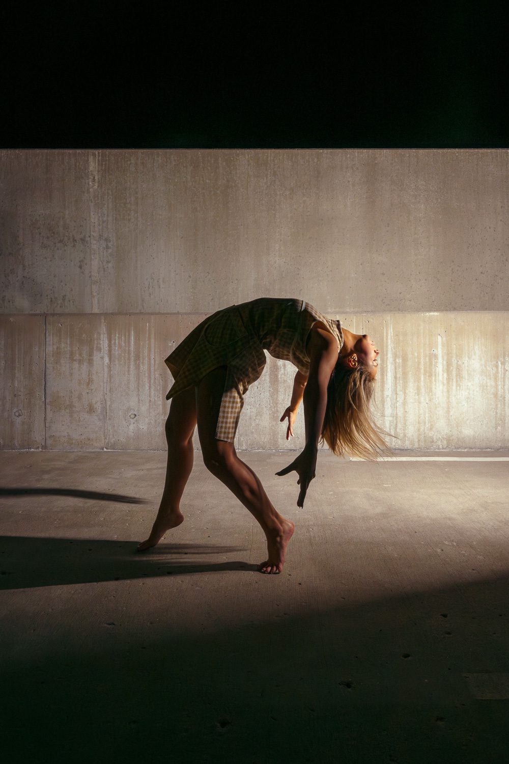 female dancer on top of parking garage at night