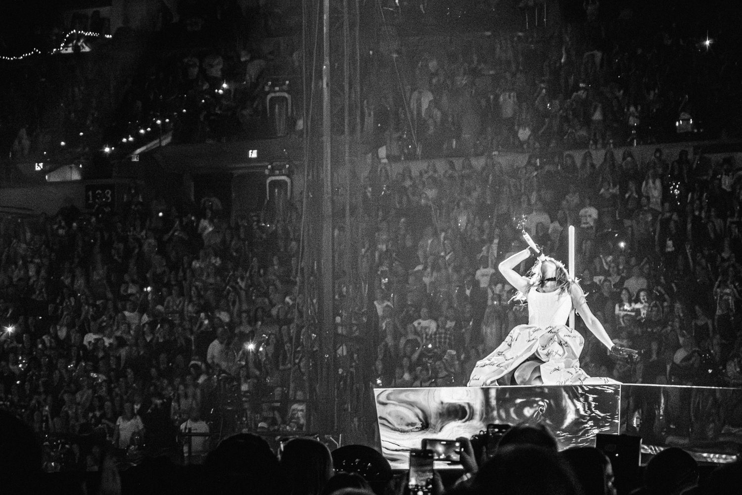 Taylor Swift sings from her knees Eras Tour at Lucas Oil Stadium in Indianapolis, Indiana during night three.