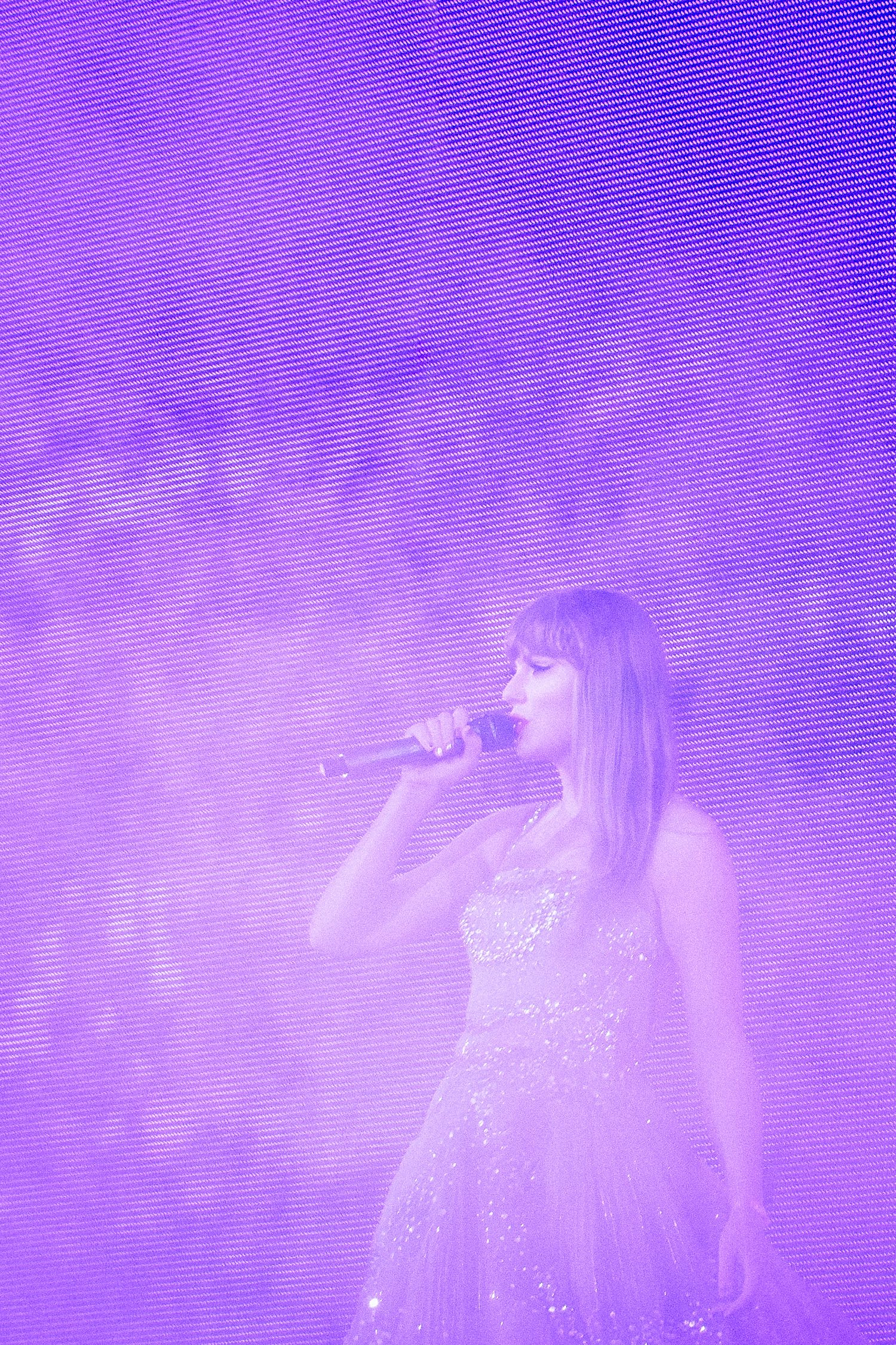 taylor swift wearing princess dress purple light