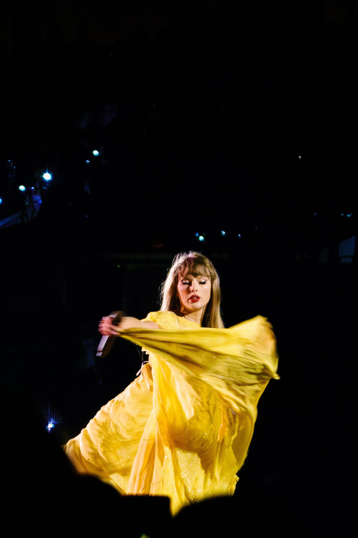 Taylor swift swings yellow flowy dress in air