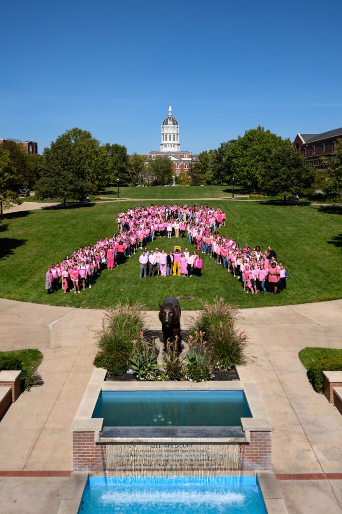 faculty and students make pink ribbon for breast cancer on MU Campus