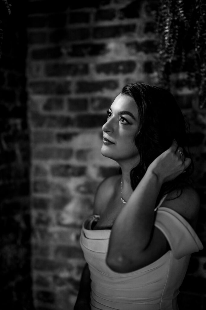 bride looking into light from windwo