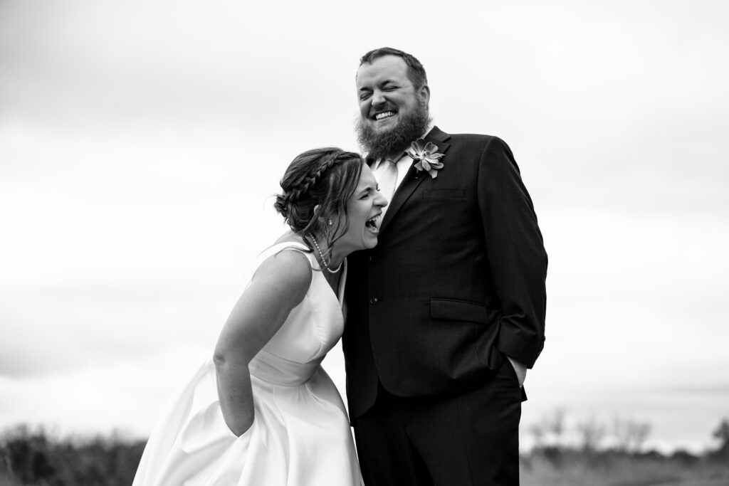 bride and groom laughing