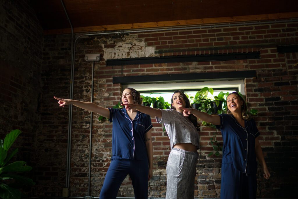 bridesmaids and bride practice dancing in pajamas before wedding